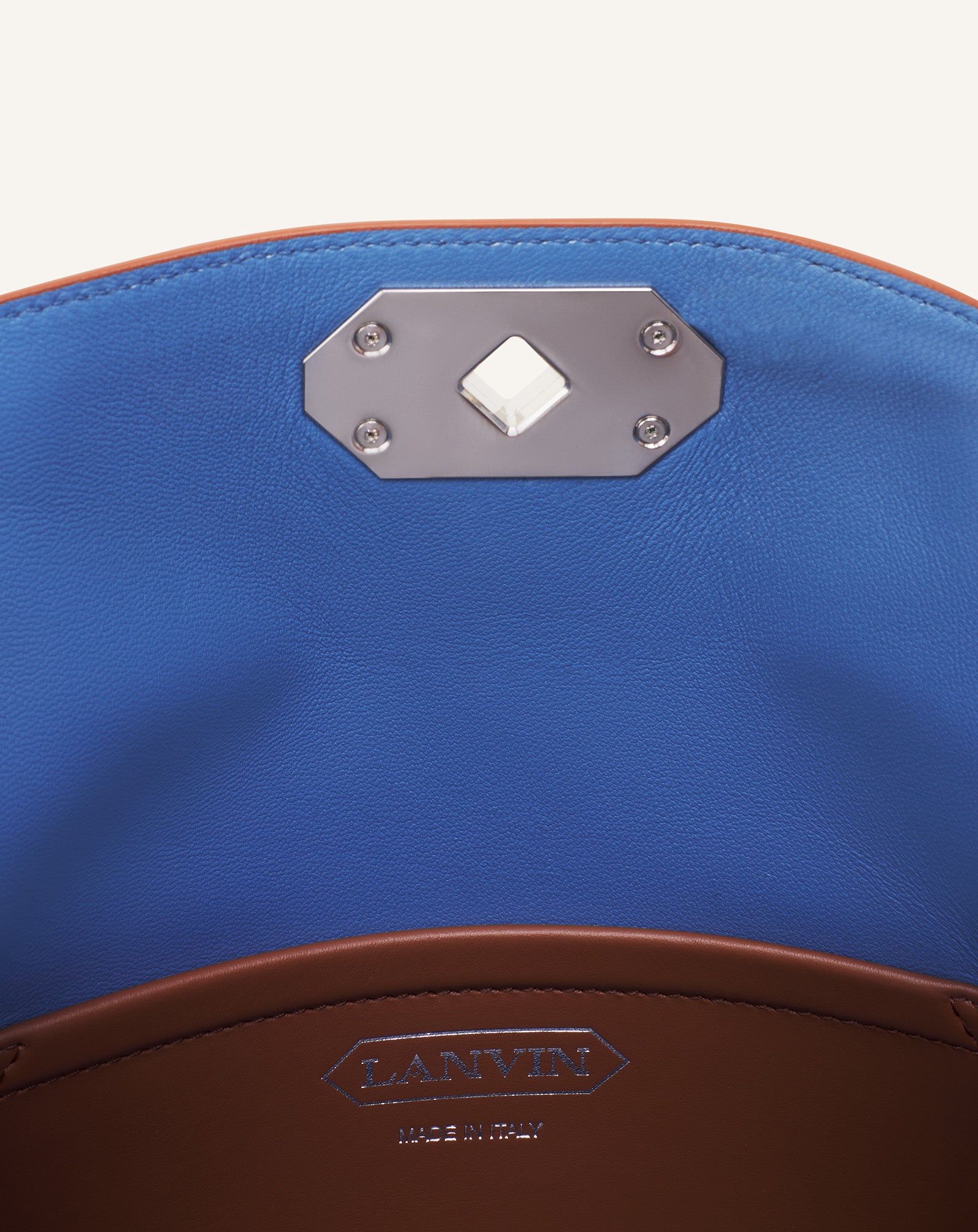 COMPAGNON ASYMMETRICAL LEATHER CLUTCH BAG