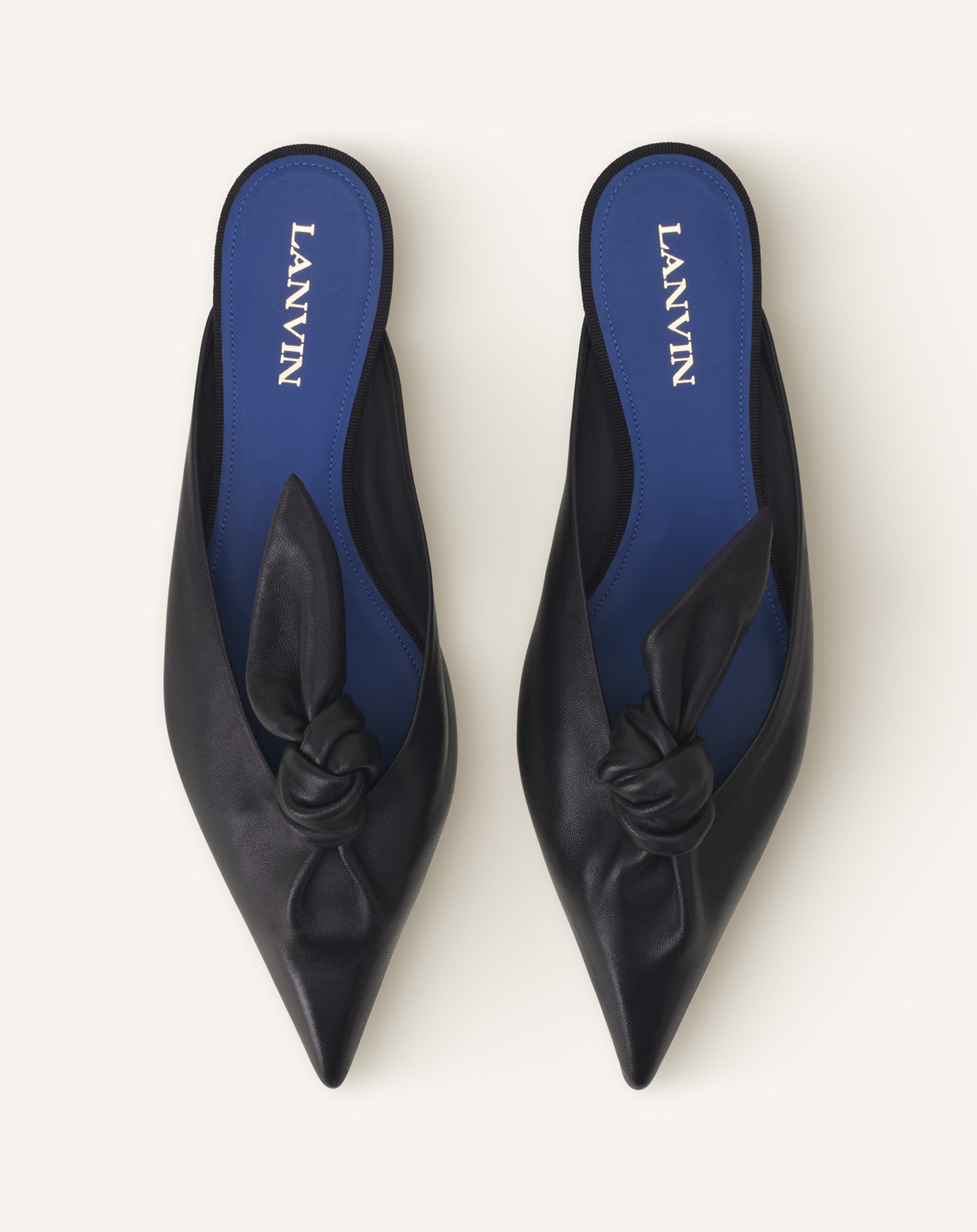 BLACK MIDNIGHT STEP MULE WITH A LEATHER BOW